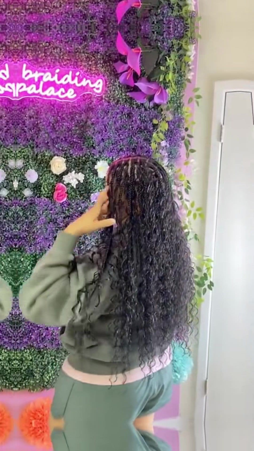 Rear view of curly bohemian braids falling past the waist