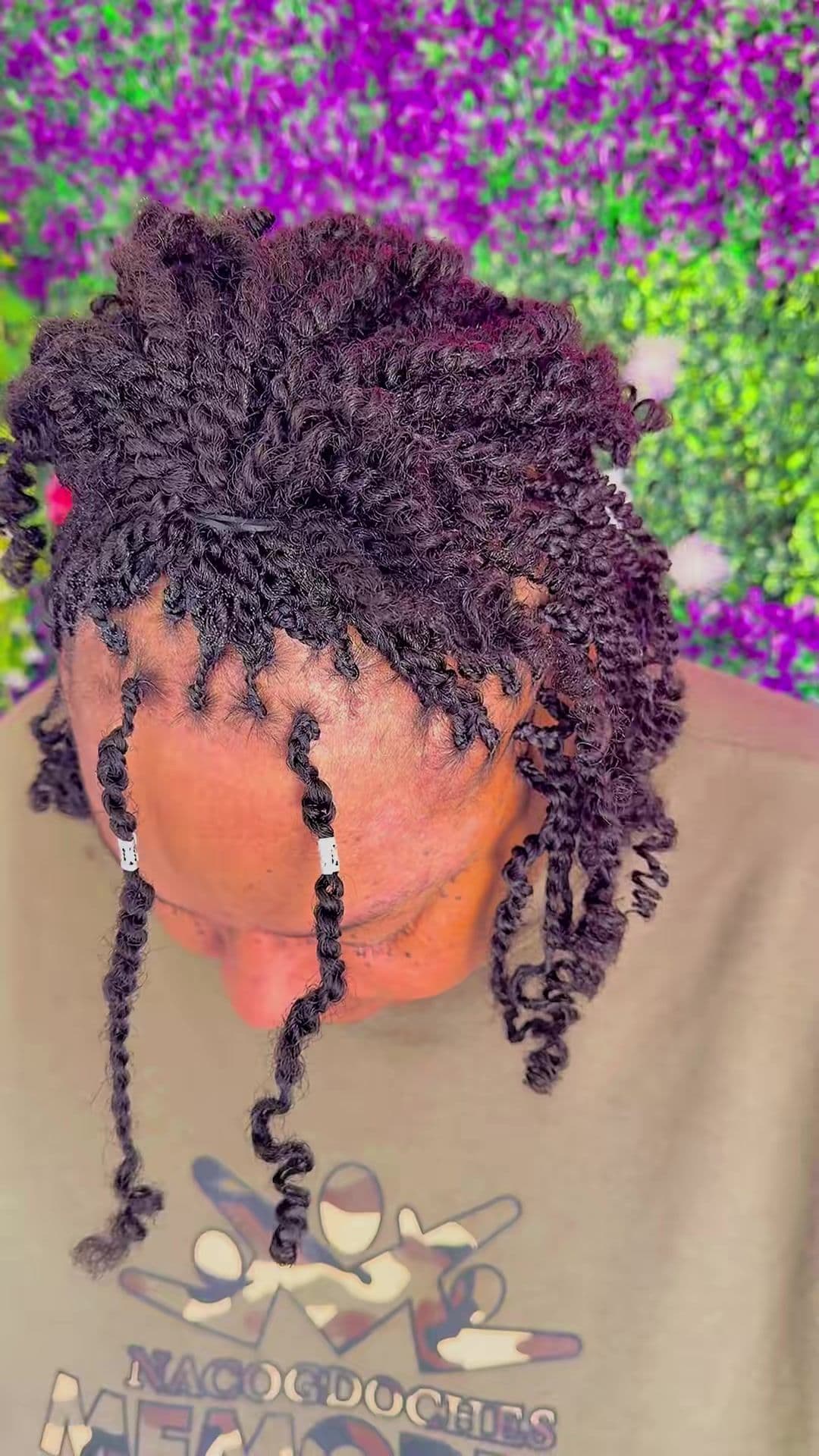 Back view of two-strand twists finished with beads at the ends